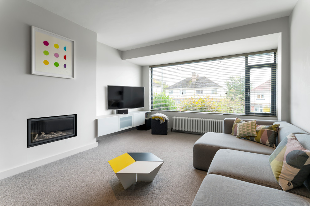 This is an example of a scandinavian family room in Glasgow.