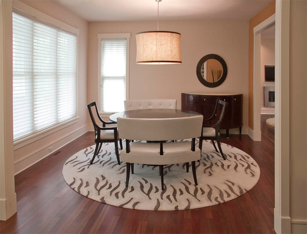 This is an example of a mid-sized contemporary separate dining room in Chicago with beige walls and dark hardwood floors.