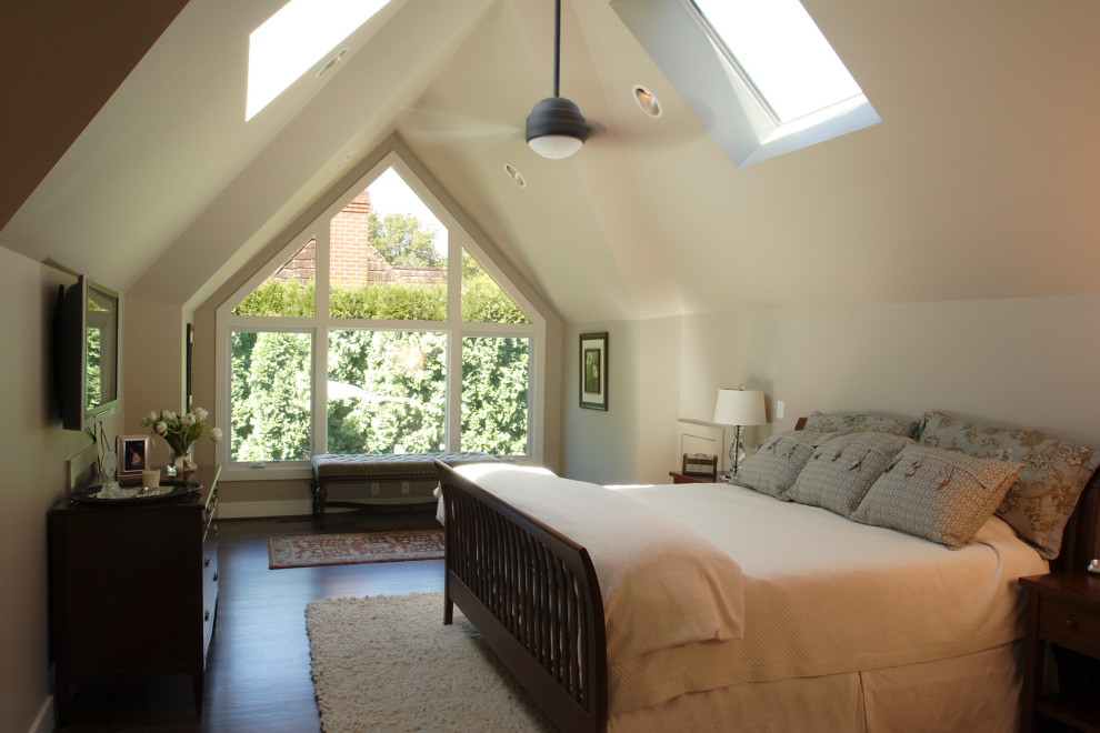 Mid-sized traditional master bedroom in Portland with beige walls, dark hardwood floors and vaulted.