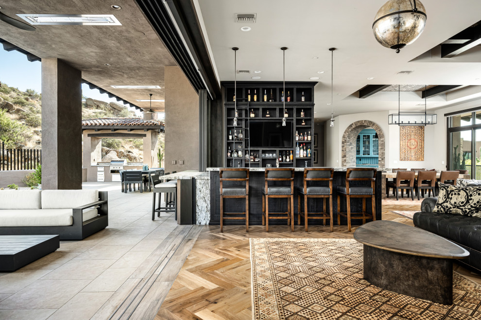 Design ideas for an expansive home bar in Phoenix.
