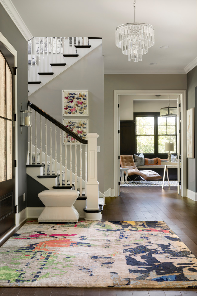 Colorful Traditional - A growing young family with two daughters, this couple hired Brandi to complete their home’s interior decor. She loved working with these fantastic clients – they eagerly embraced a playful use of color and bold design choices! Finished in a colorful traditional style, this home is full of timeless architecture mixed with modern details. From a navy and bright orange office to a green floral dining room, each room on the main floor makes a unique statement but flows together through similar artwork and rugs. Upstairs, the master bedroom is a serene sanctuary. Brandi added wood beams, handmade wall coverings, and an extra custom-built closet. The two girls’ bedrooms are all about fun trends, personalized touches, and plenty of storage for their many prized possessions.
