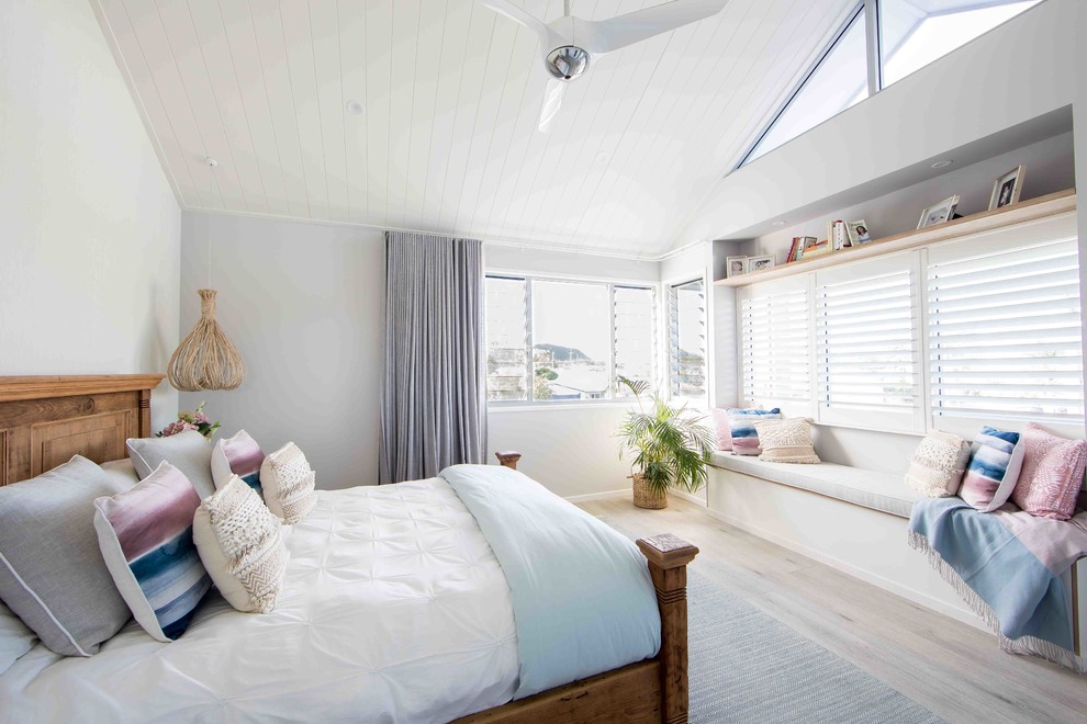 Photo of a beach style bedroom in Gold Coast - Tweed with grey walls.