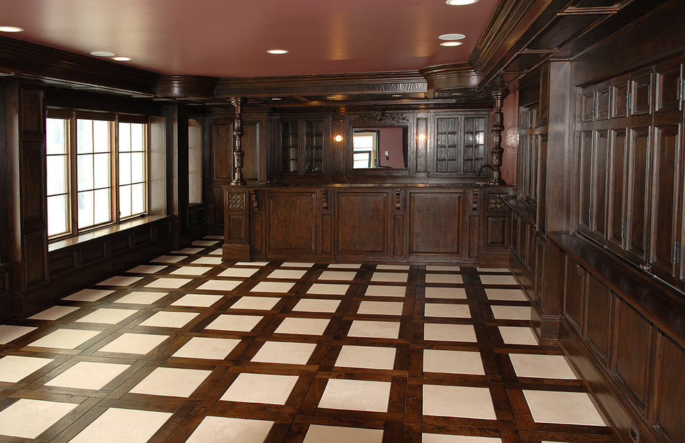 Inspiration for a huge timeless galley dark wood floor and brown floor seated home bar remodel in Chicago with raised-panel cabinets and dark wood cabinets