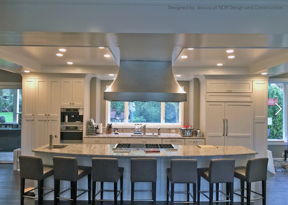 Example of a large transitional single-wall eat-in kitchen design in Seattle with shaker cabinets, white cabinets, quartzite countertops, stainless steel appliances, an island and white countertops