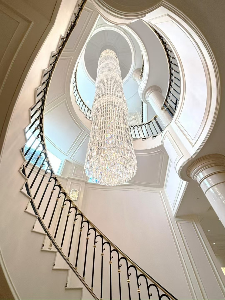 Huge transitional painted spiral metal railing and shiplap wall staircase photo with wooden risers