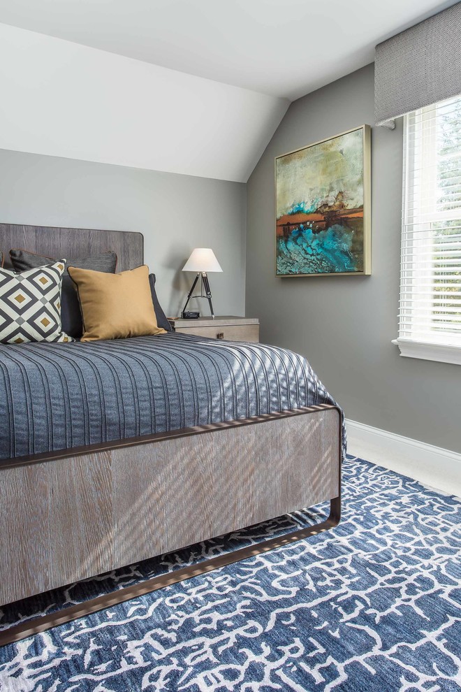 Photo of an expansive transitional guest bedroom in Columbus with grey walls, carpet, no fireplace and beige floor.