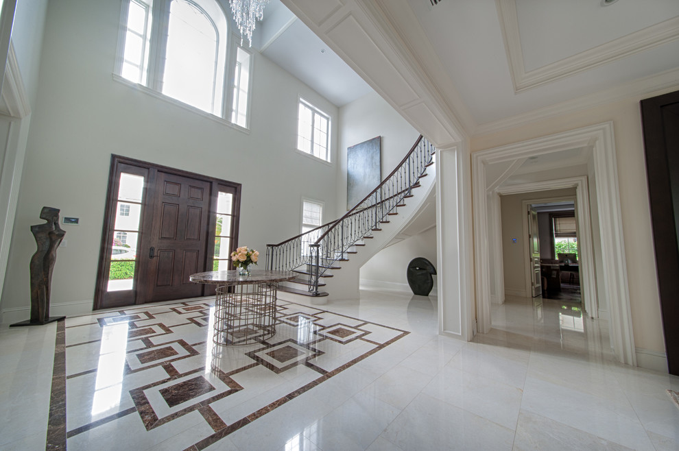 Expansive transitional foyer in Miami with white walls, porcelain floors, a single front door, a dark wood front door and multi-coloured floor.