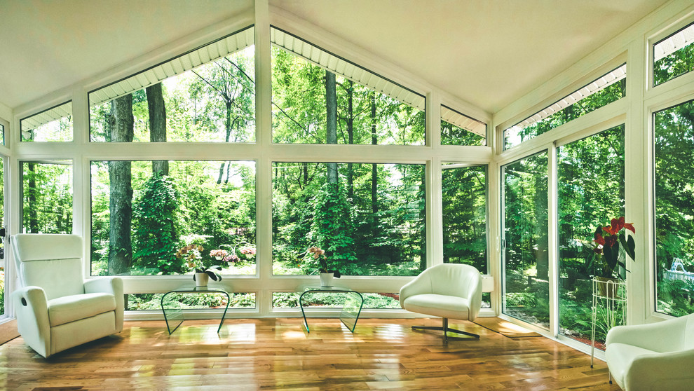 This is an example of a mid-sized modern sunroom in Other.