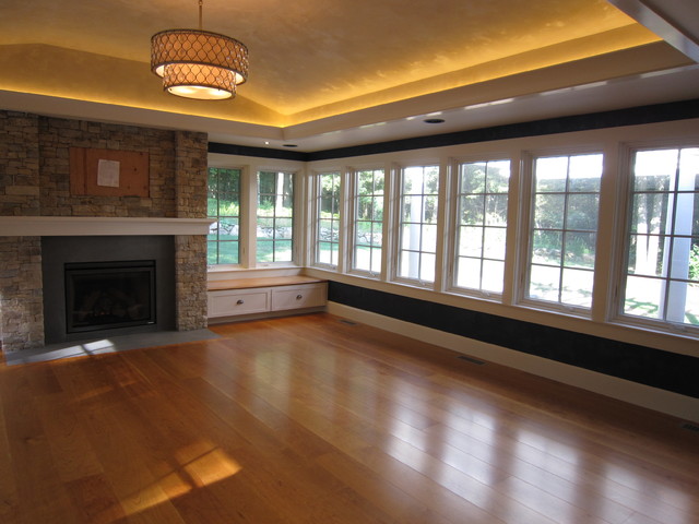 Sunroom With Stone Fireplace Tray Ceiling Led Lighting Leather