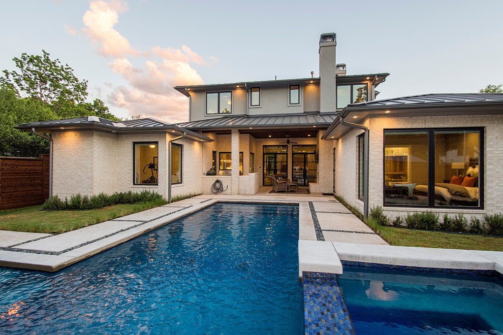 Modern backyard rectangular pool in Dallas with a hot tub.