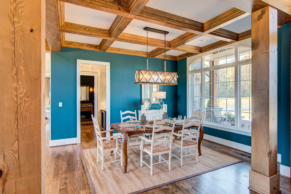 Design ideas for an expansive transitional dining room in Other with blue walls and medium hardwood floors.