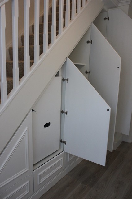 custom designed under stairs storage unit traditional-hall