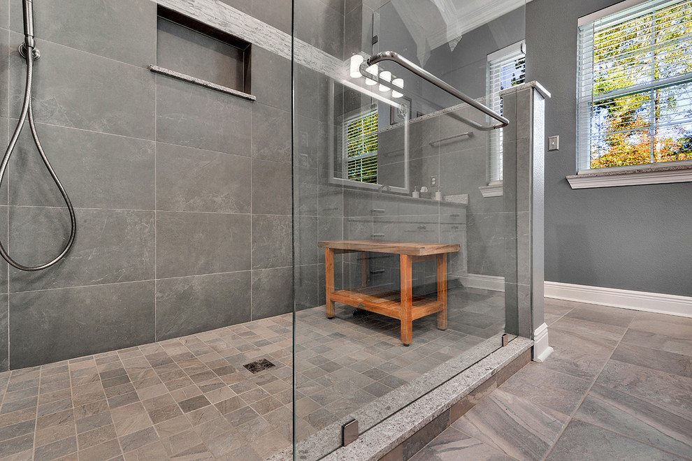Design ideas for a mid-sized traditional master bathroom in New Orleans with an undermount sink, shaker cabinets, white cabinets, engineered quartz benchtops, an alcove shower, a two-piece toilet, gray tile and porcelain tile.