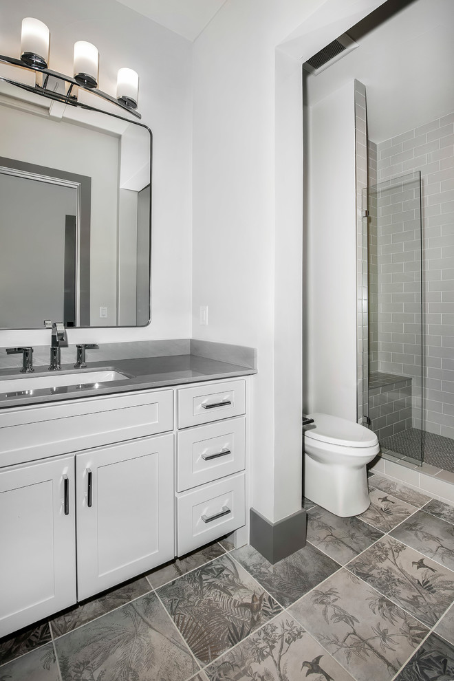 Inspiration for a mid-sized contemporary master bathroom in Denver with white cabinets, white walls and grey benchtops.