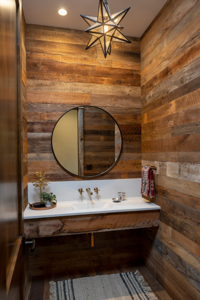 Inspiration for a mid-sized country powder room in Minneapolis with open cabinets, distressed cabinets, a one-piece toilet, gray tile, grey walls, ceramic floors, a wall-mount sink, engineered quartz benchtops, multi-coloured floor, multi-coloured benchtops, a built-in vanity and planked wall panelling.
