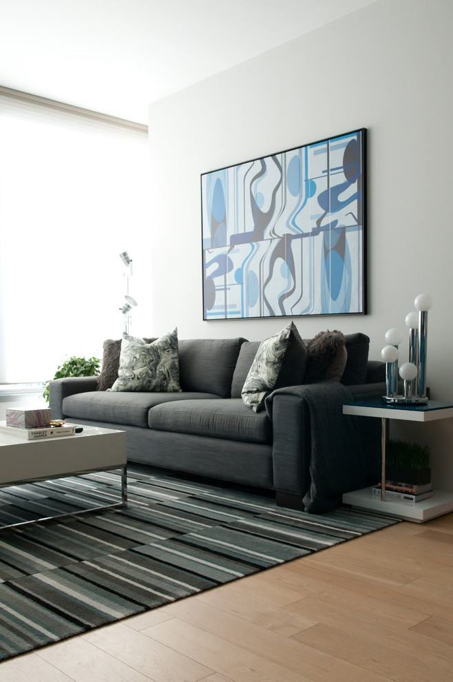 Inspiration for a mid-sized modern open concept light wood floor living room remodel in San Francisco with blue walls, no fireplace and no tv