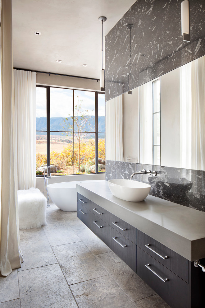 Expansive contemporary master bathroom in Denver with a freestanding tub, marble, ceramic floors, a vessel sink, grey floor, flat-panel cabinets, grey cabinets, gray tile and grey benchtops.