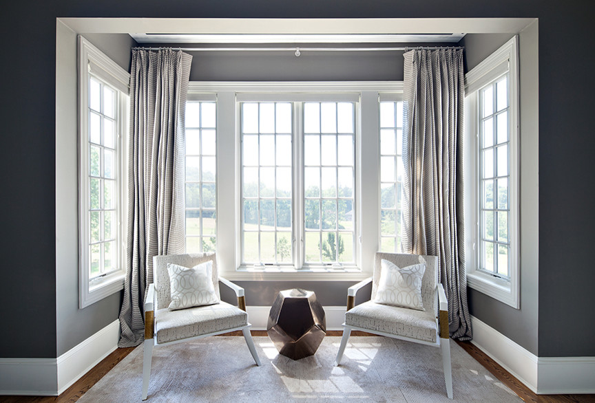 Example of a transitional bedroom design in New York