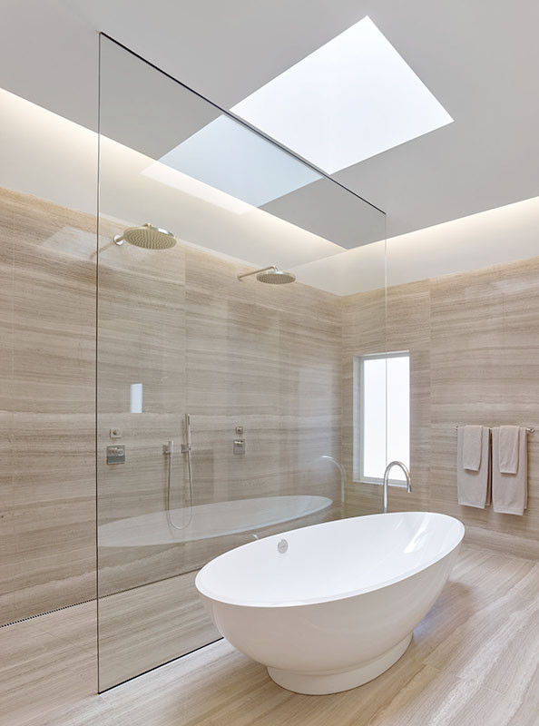 This is an example of a large modern master bathroom in San Francisco with an integrated sink, flat-panel cabinets, dark wood cabinets, engineered quartz benchtops, a freestanding tub, an open shower, a wall-mount toilet, gray tile, stone slab, grey walls and marble floors.
