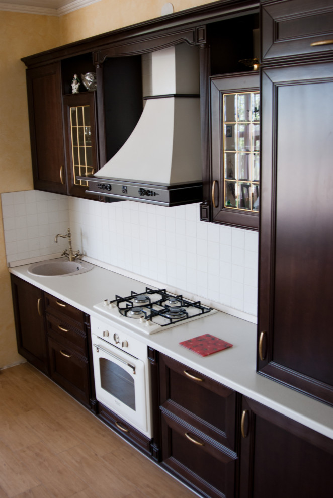 This is an example of a small traditional kitchen in Other.