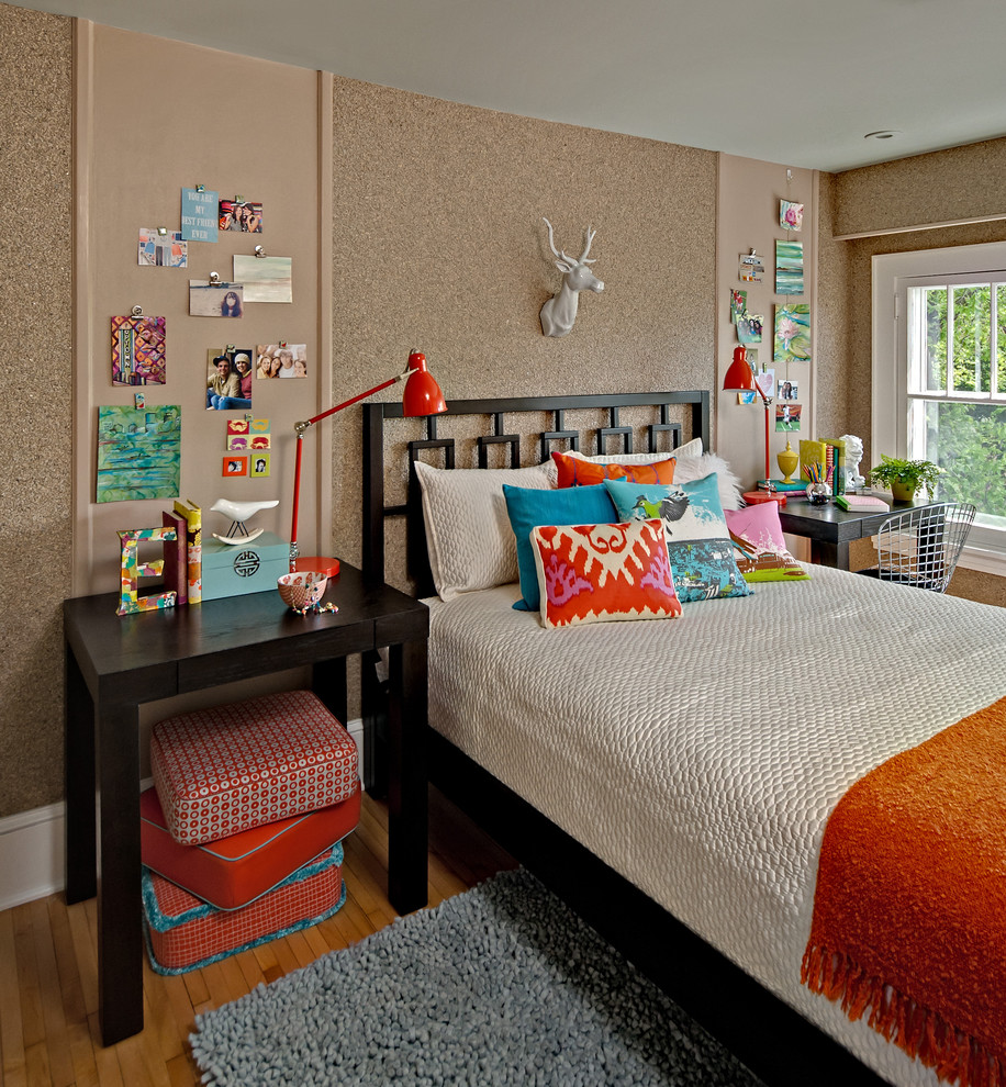 This is an example of a mid-sized eclectic kids' room for girls in Minneapolis with medium hardwood floors, beige floor and brown walls.
