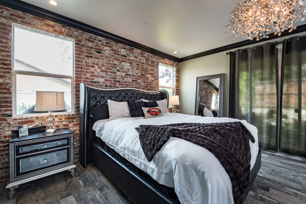This is an example of a mid-sized industrial master bedroom in Other with beige walls, dark hardwood floors, no fireplace and brown floor.