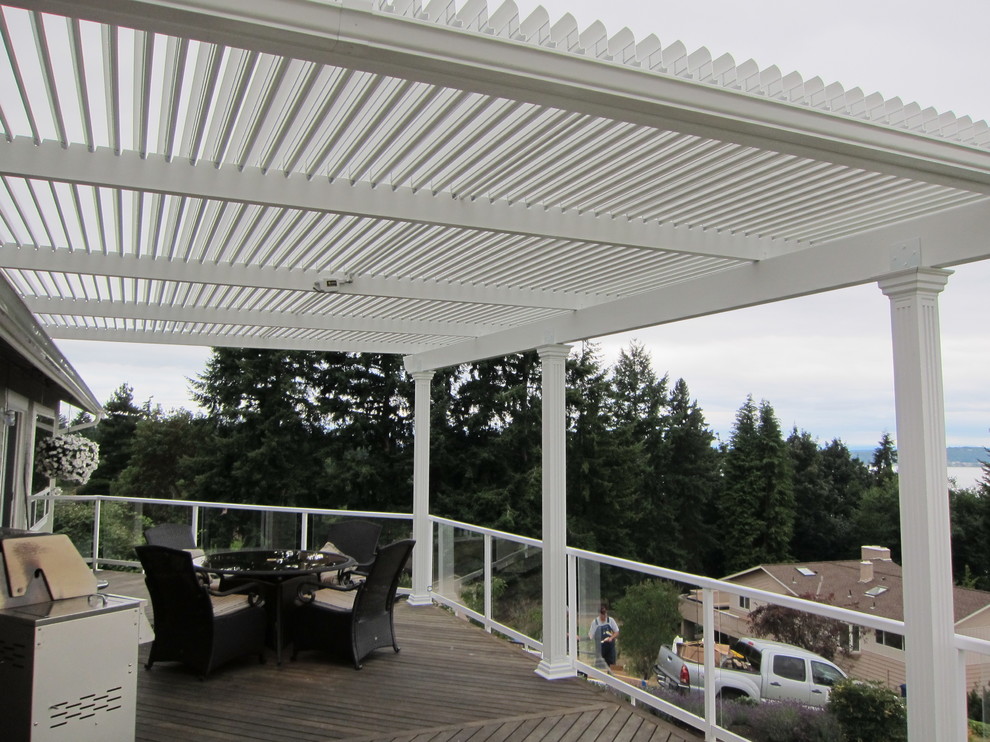 Large transitional backyard deck photo in Phoenix with a roof extension