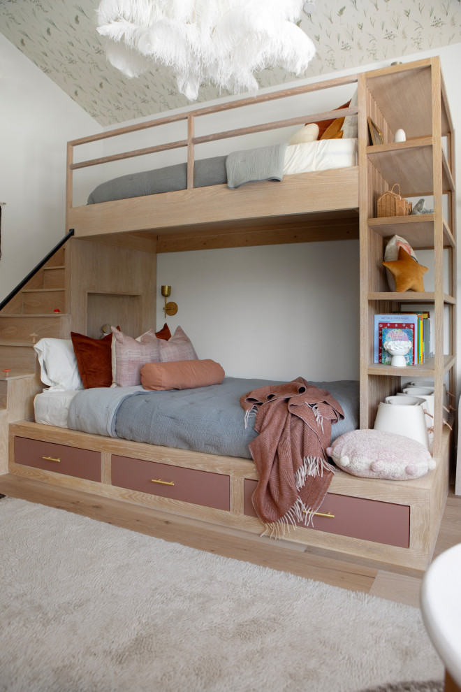 Hill Country Modern Meets Southlake, Texas - This Hill Country Modern home in Southlake combines modern design with comfort, featuring light-filled spaces and unique details reflecting the family's eclectic style for play and sophistication. 

This charming kids' room features cozy bunk beds adorned with soft bedding, a delightful window seat, whimsical lighting, and playful decor, all harmonizing in a serene neutral palette.