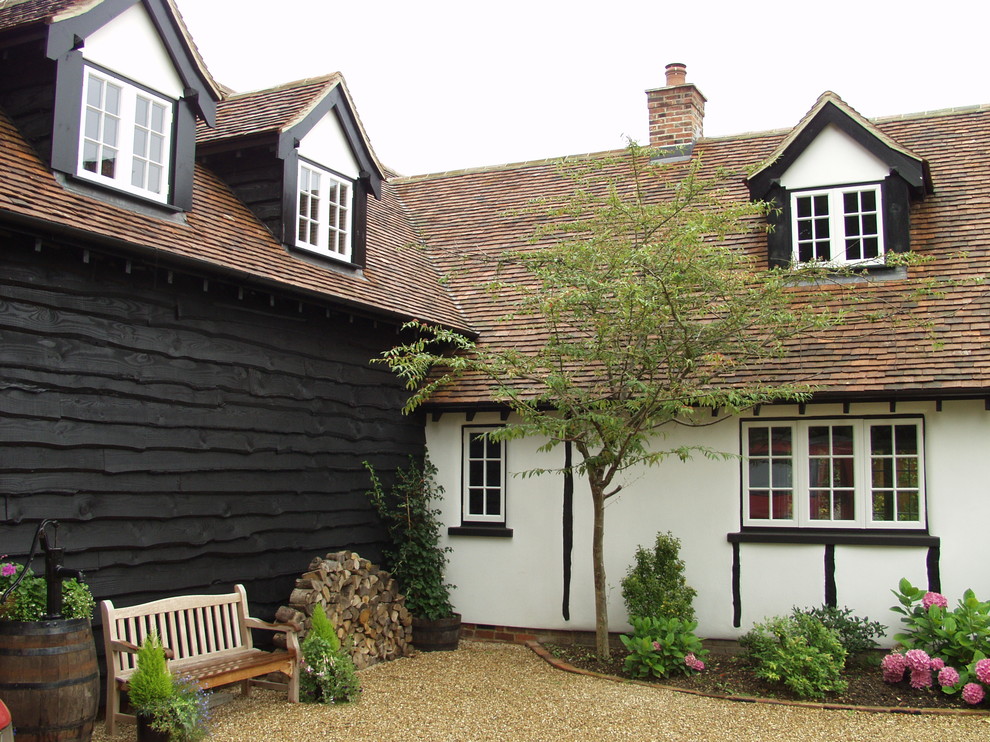 Country exterior in Oxfordshire with wood siding.