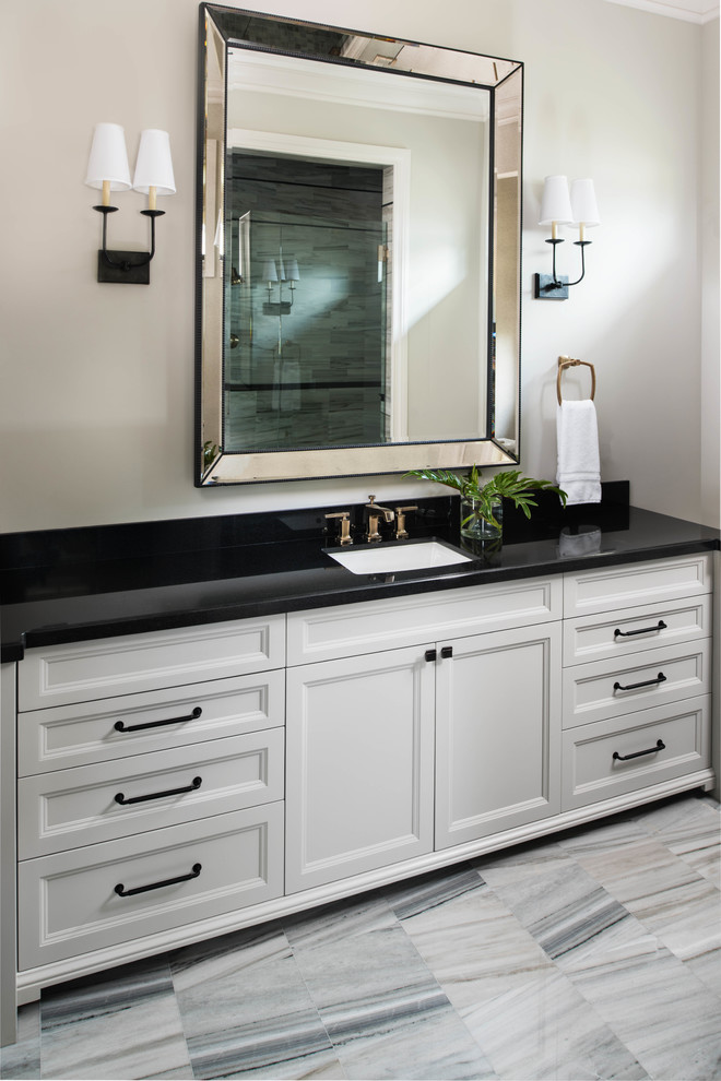 Mid-sized transitional bathroom in Miami with recessed-panel cabinets, white cabinets, marble floors, an undermount sink, granite benchtops, white floor, black benchtops, a single vanity and a built-in vanity.