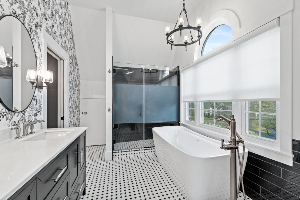 Freestanding bathtub - mid-sized eclectic master black tile and ceramic tile ceramic tile, white floor, double-sink, vaulted ceiling and wallpaper freestanding bathtub idea in Kansas City with raised-panel cabinets, black cabinets, a one-piece toilet, white walls, an undermount sink, quartz countertops, a hinged shower door, white countertops, a niche and a freestanding vanity