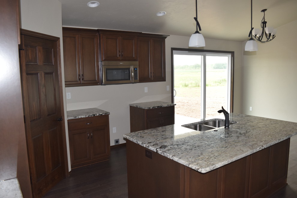 Home design - rustic home design idea with white cabinets, stainless steel appliances and an island