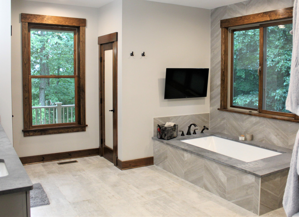 Design ideas for a large transitional master wet room bathroom in DC Metro with an undermount tub, beige tile, ceramic tile, ceramic floors, granite benchtops, grey floor, an open shower, grey benchtops, a shower seat, a double vanity and a floating vanity.