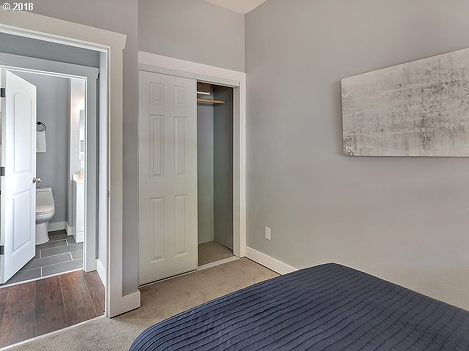 Inspiration for a small arts and crafts built-in wardrobe in Portland with carpet and grey floor.