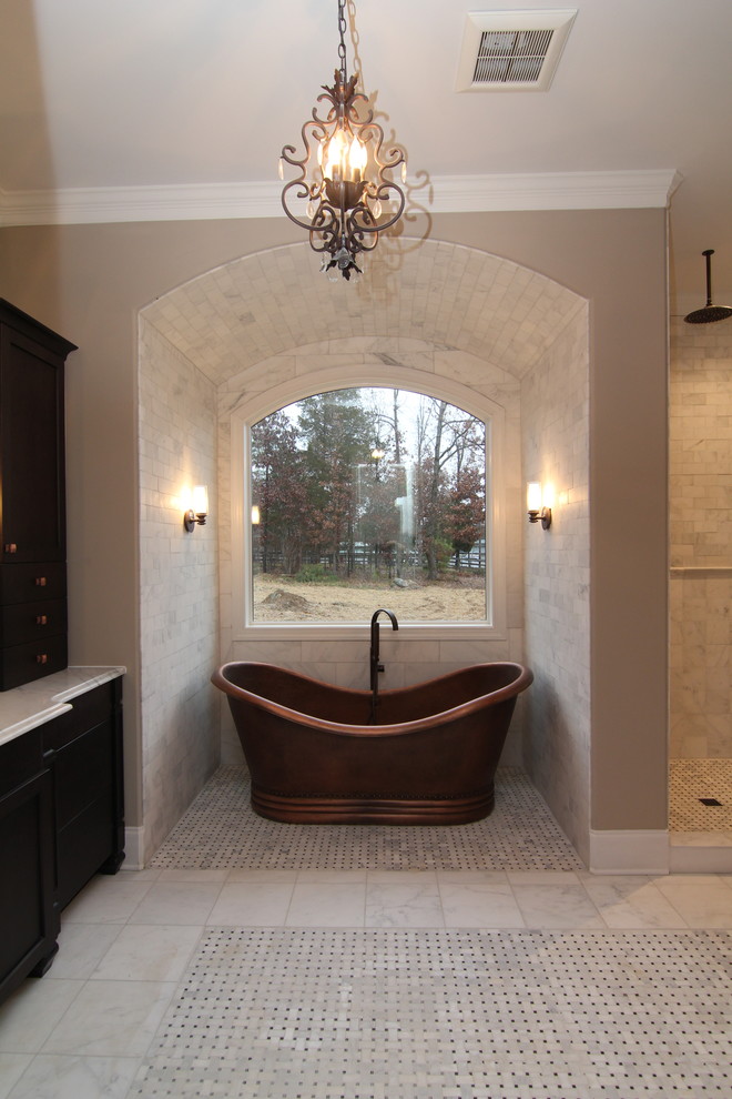 Photo of an expansive arts and crafts master bathroom in Raleigh with an undermount sink, furniture-like cabinets, dark wood cabinets, granite benchtops, a freestanding tub, an open shower, a one-piece toilet, white tile, ceramic tile, grey walls and ceramic floors.