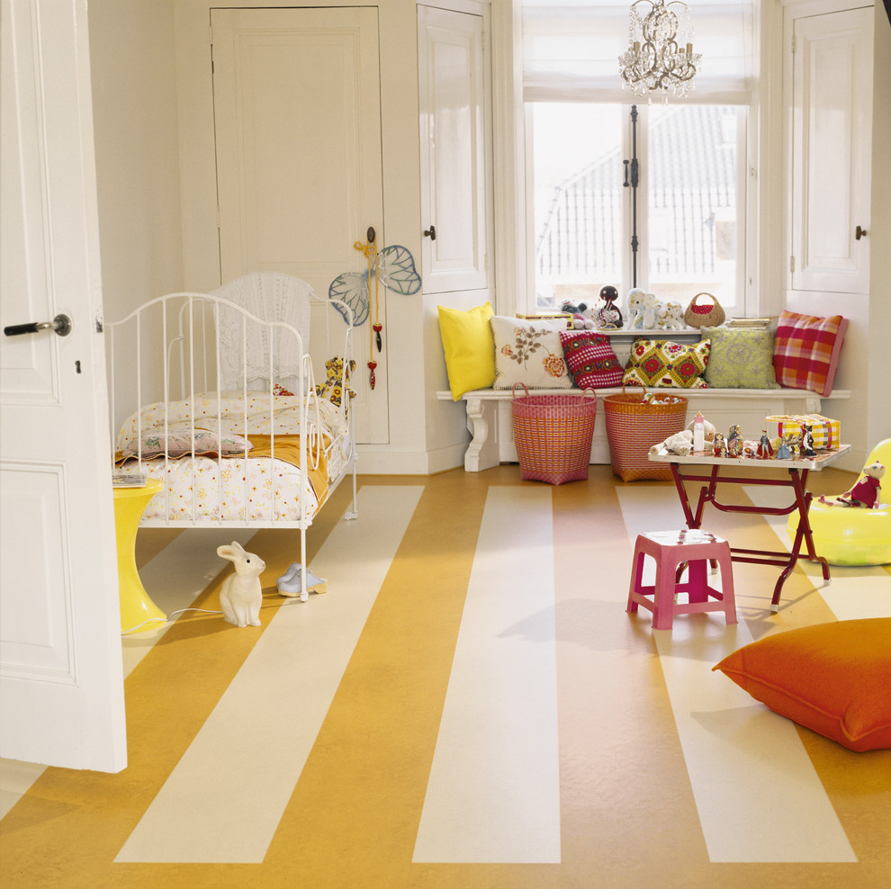 Photo of a mid-sized traditional gender-neutral kids' bedroom for kids 4-10 years old in Chicago with white walls, linoleum floors and yellow floor.