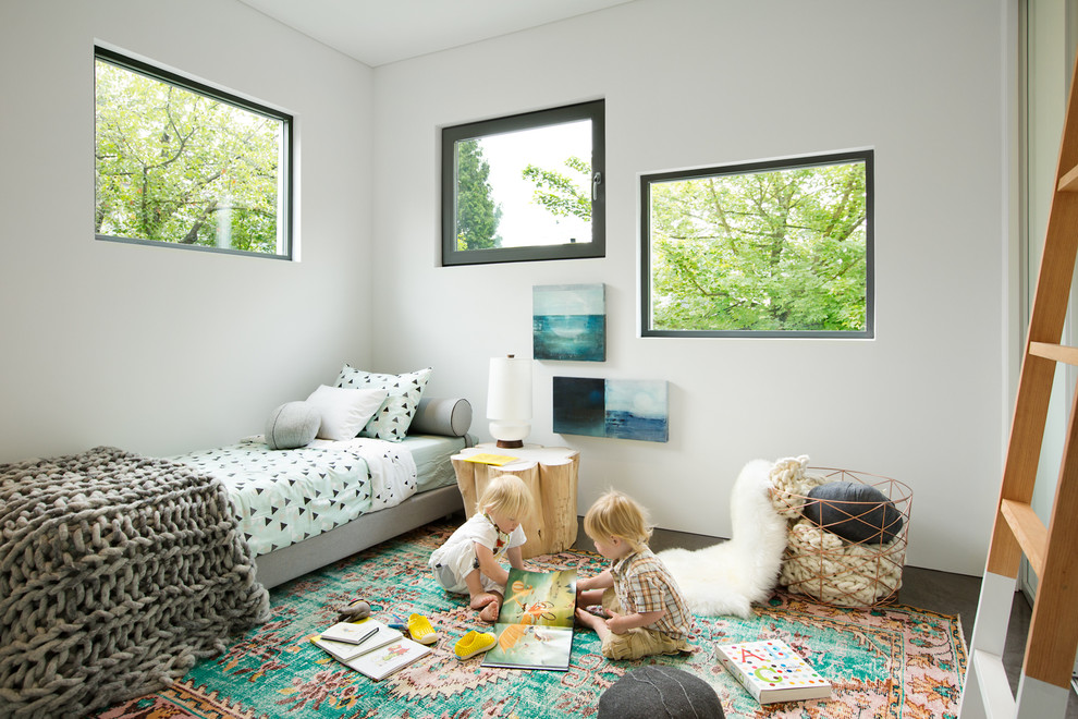 Photo of a mid-sized contemporary gender-neutral kids' bedroom for kids 4-10 years old in Vancouver with white walls.