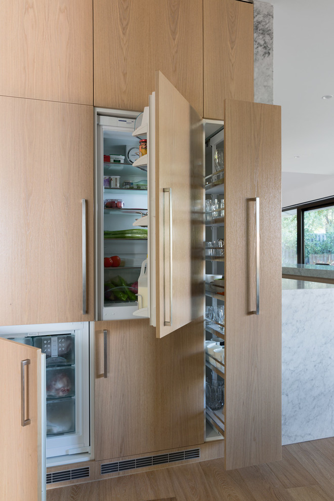 Photo of a modern kitchen in Melbourne with panelled appliances.