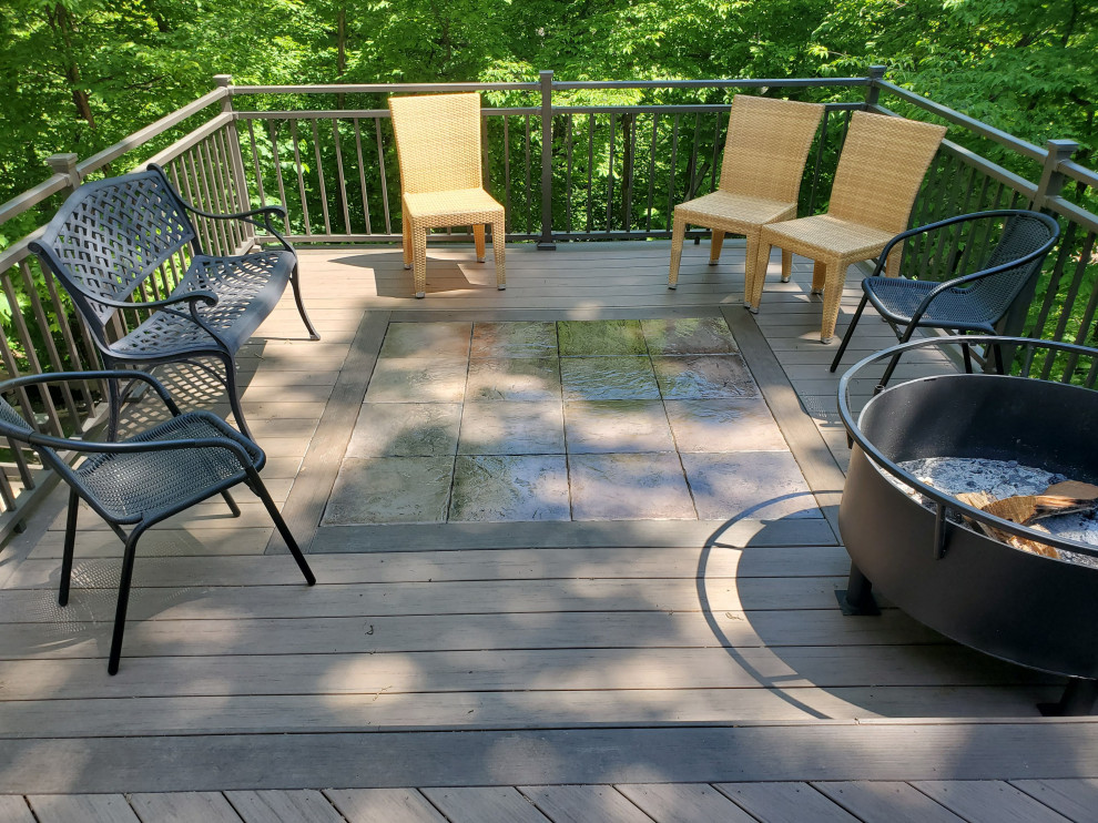 Deck - large backyard ground level metal railing deck idea with no cover