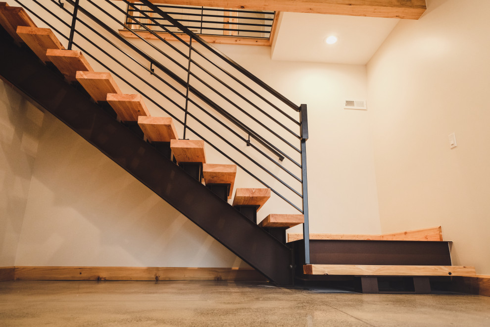 Modelo de escalera en L minimalista de tamaño medio sin contrahuella con escalones de madera y barandilla de metal