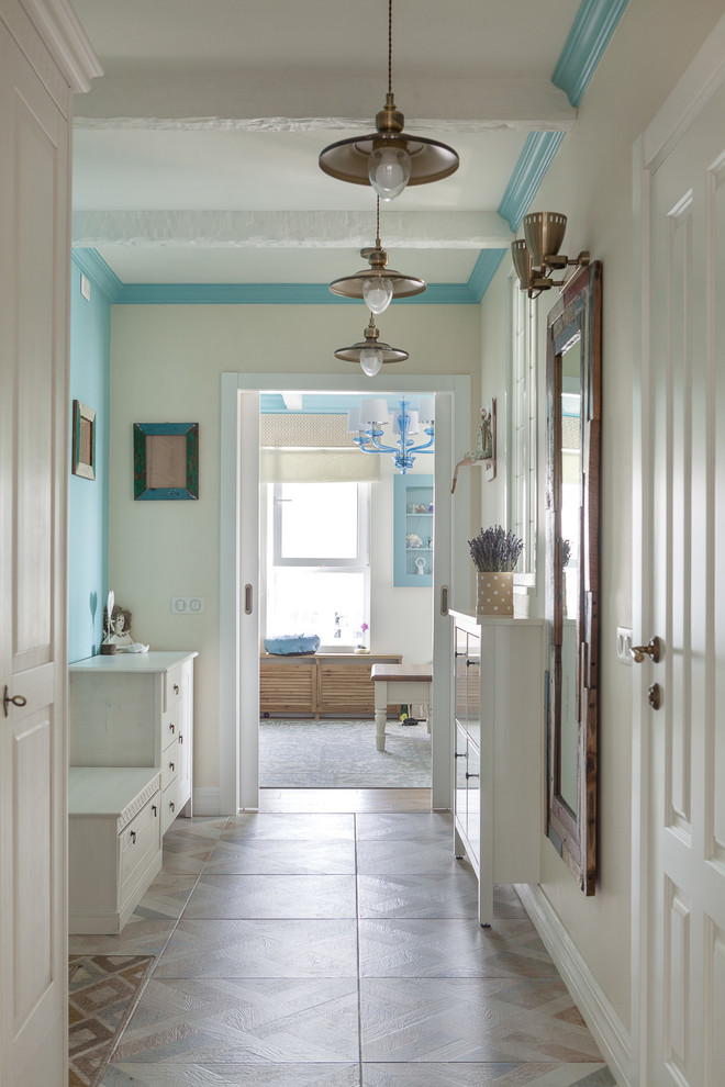 Mid-sized beach style hallway in Moscow with white walls, ceramic floors and multi-coloured floor.