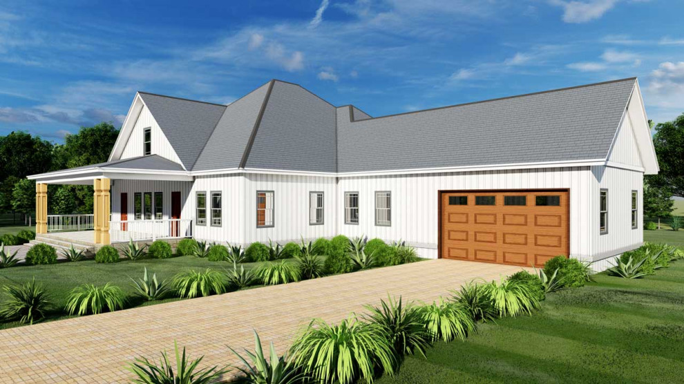 На фото: частный загородный дом среднего размера в стиле кантри с облицовкой из металла, металлической крышей и отделкой дранкой с