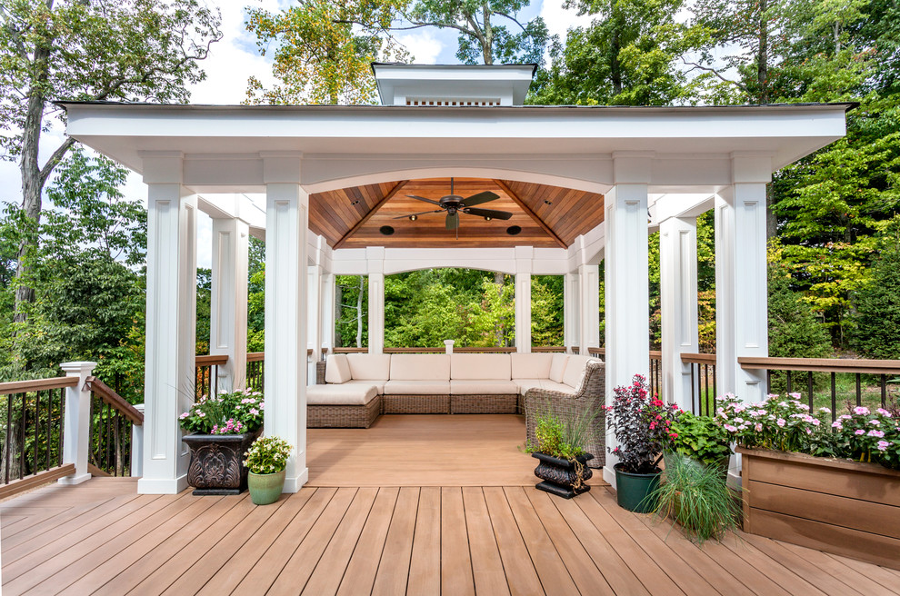 This is an example of a large traditional backyard deck in New York with mixed railing.
