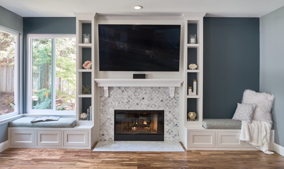 Medium sized contemporary open plan games room in San Francisco with grey walls, medium hardwood flooring, a standard fireplace, a tiled fireplace surround, a wall mounted tv and brown floors.