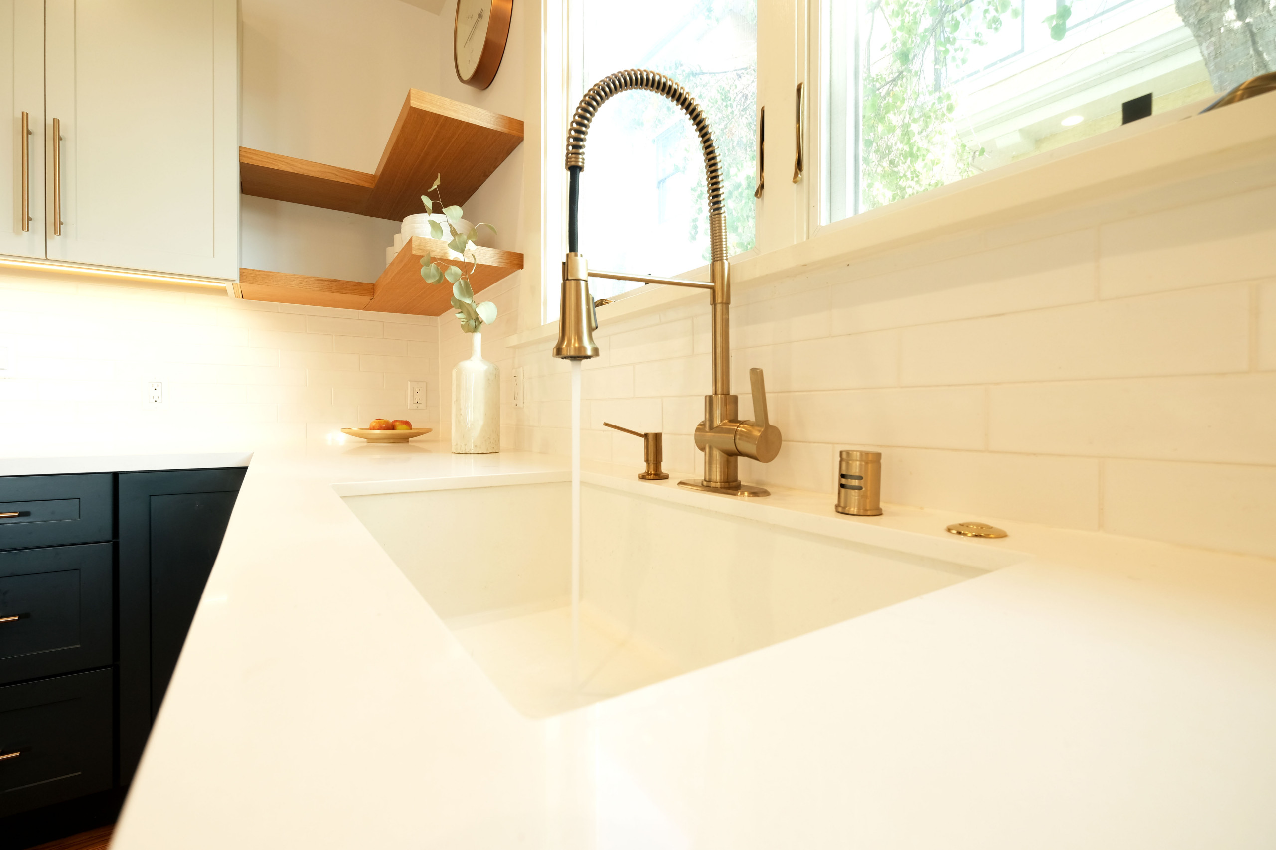 Contemporary Navy Kitchen with Brass Accents
