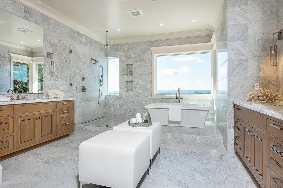 Inspiration for a transitional bathroom in San Francisco with recessed-panel cabinets, medium wood cabinets, a freestanding tub, an open shower, gray tile, an undermount sink and an open shower.