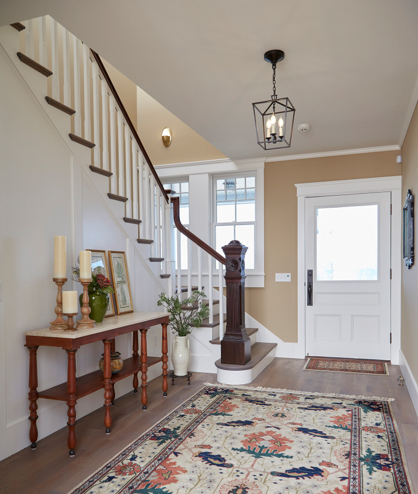 Large transitional foyer in Providence with yellow walls, medium hardwood floors, a single front door, a white front door, grey floor and panelled walls.