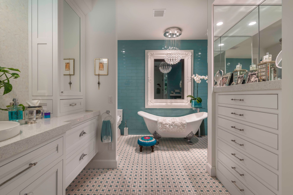 Design ideas for an expansive beach style master bathroom in Miami with shaker cabinets, white cabinets, a freestanding tub, a one-piece toilet, green tile, glass tile, porcelain floors, a vessel sink, multi-coloured floor, grey benchtops, a double vanity and a built-in vanity.