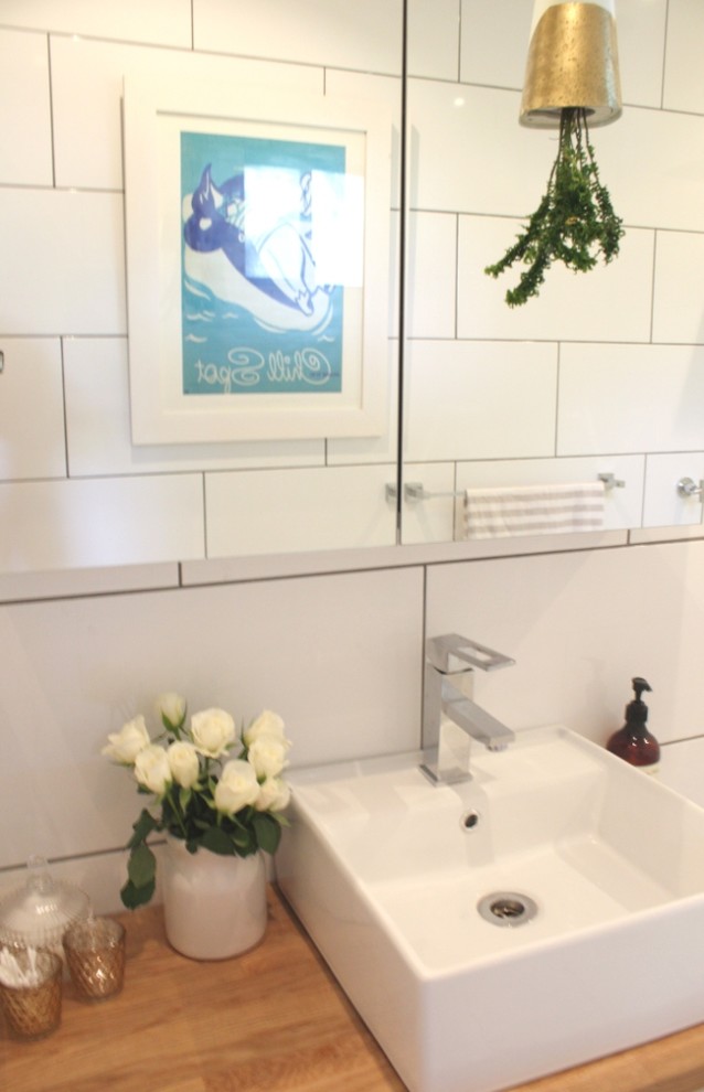 Inspiration for a small contemporary bathroom in Dunedin with a vessel sink, open cabinets, light wood cabinets, a double shower, a one-piece toilet, white tile, ceramic tile, white walls and marble floors.