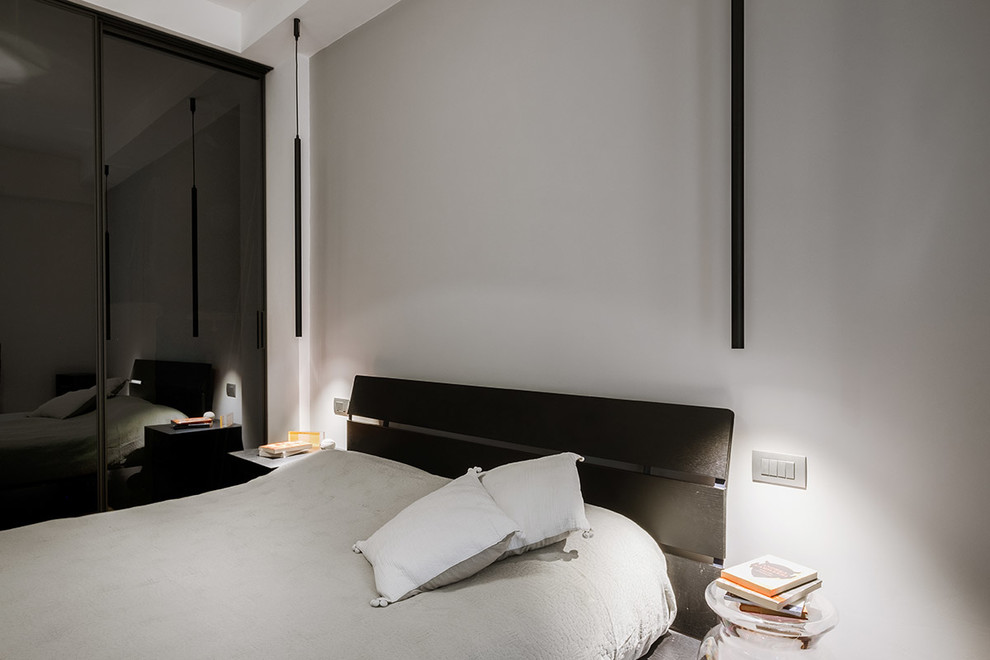 Design ideas for a mid-sized contemporary master bedroom in Rome with grey walls.